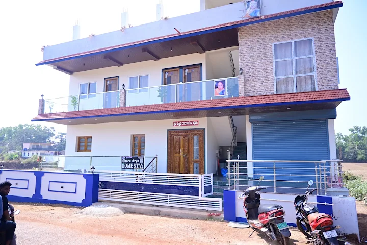 Shri Arya Home Stay signboard at the entrance of the property